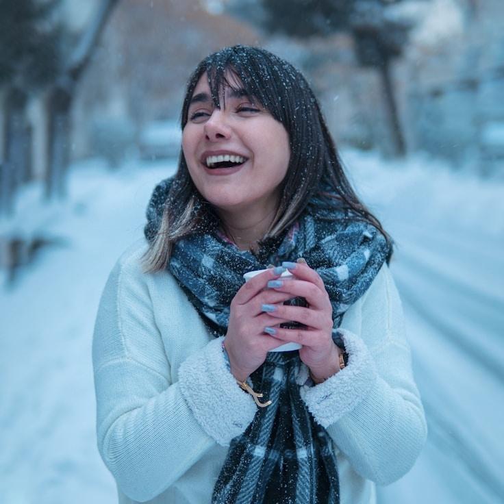 Kaveri Mehta, Lead Design Curator at CommuniVertiCentra, reviewing corporate floral arrangements